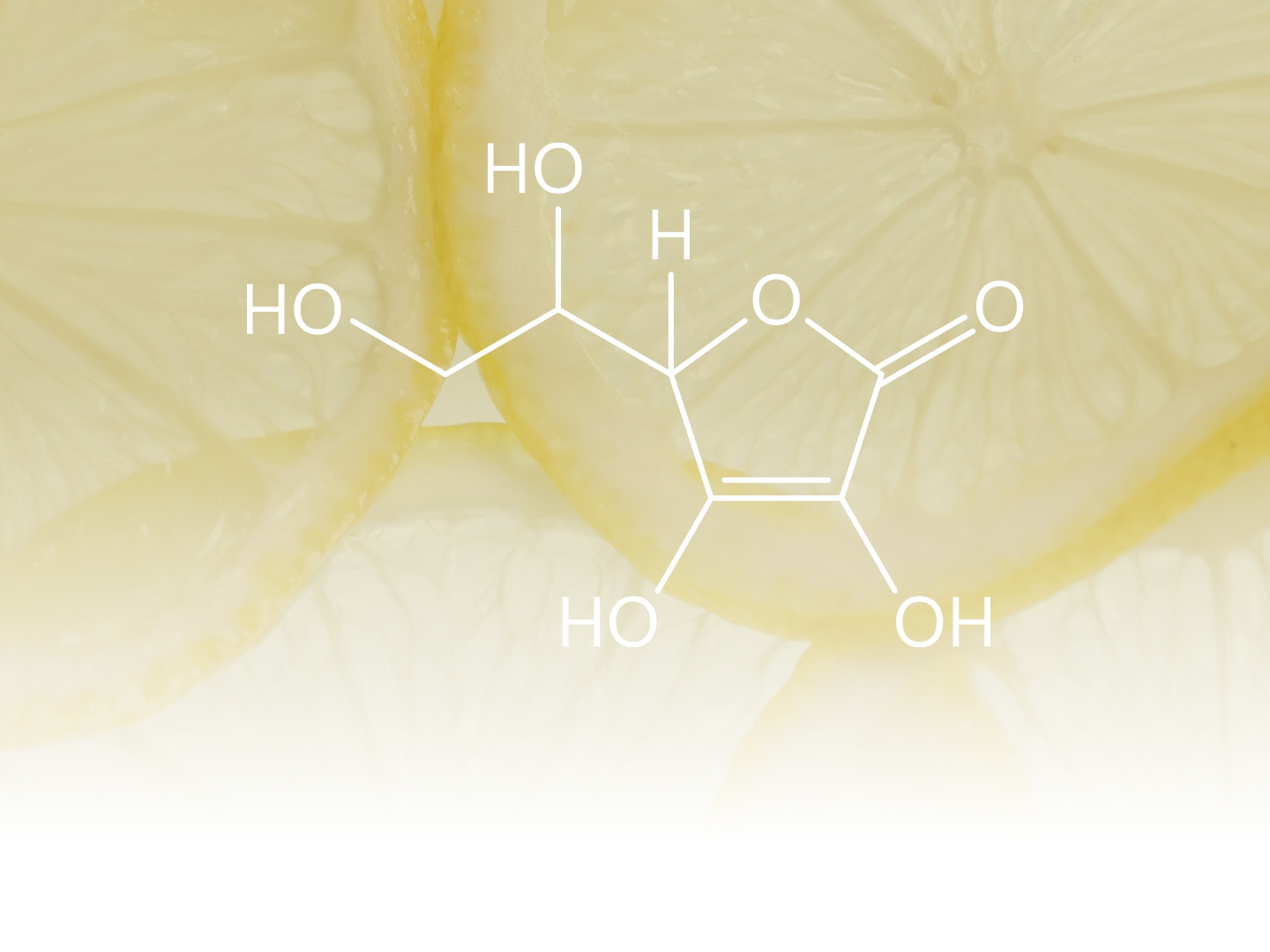 Abgesoftet im Hintergrund die Nahaufnahme von Zitronenscheiben, darauf die Strukturformel des Vitamin C